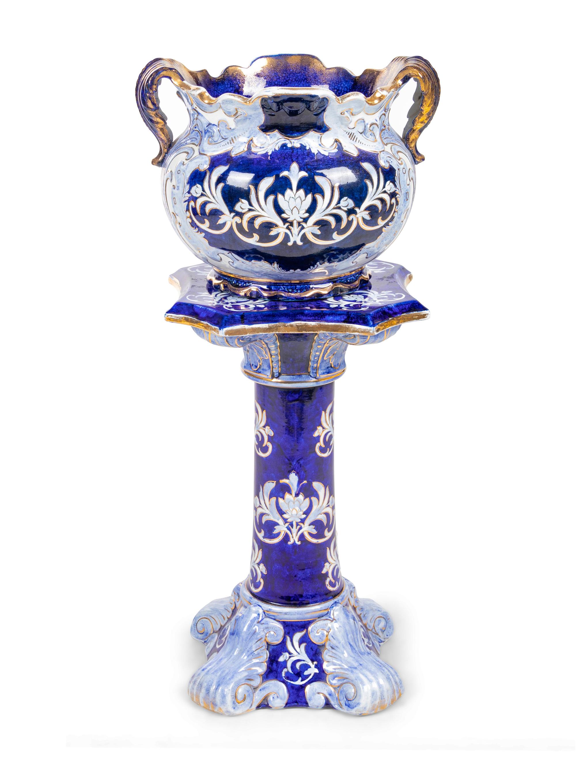 A Flow Blue Double Handled Vase on Stand