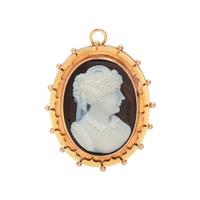 ANTIQUE, BICOLOR GOLD AND ONYX CAMEO PENDANT/BROOCH