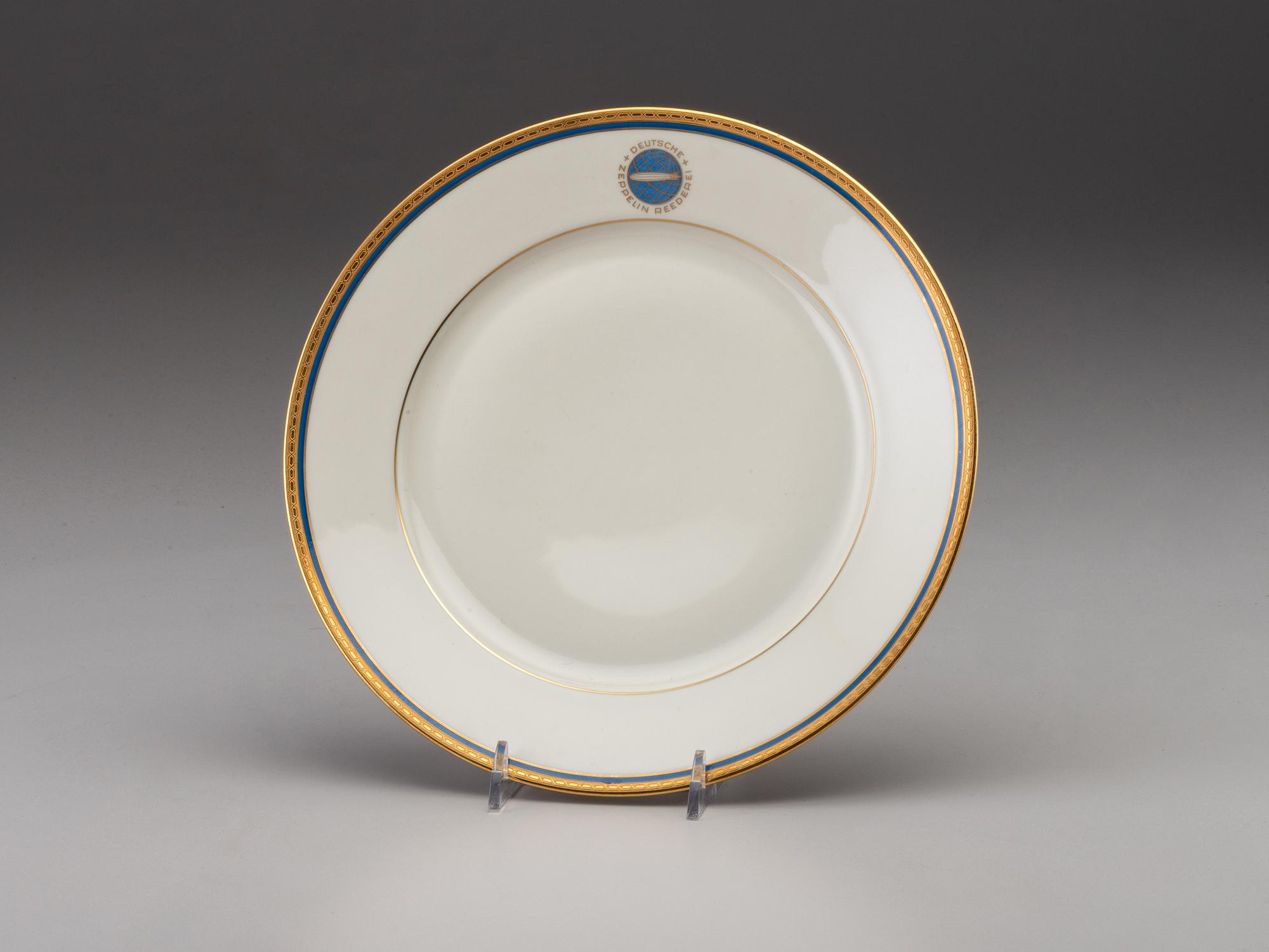 [TRANSPORTATION] - [ZEPPELIN]. Set of Deutsche Zeppelin-Reederei porcelain with dinner plates, salad plates, and sherbet glasses.