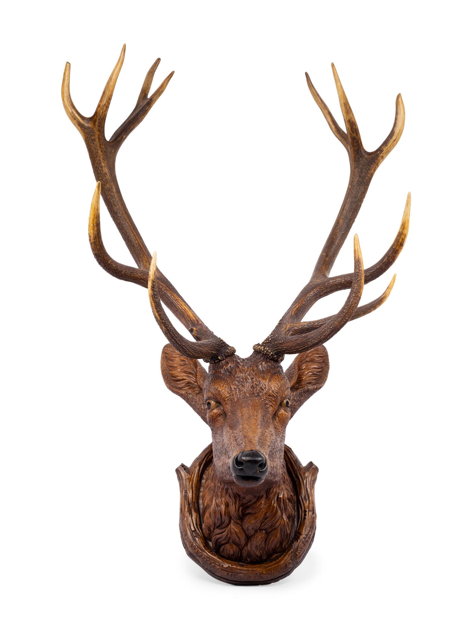 A Black Forest Carved Stag Head