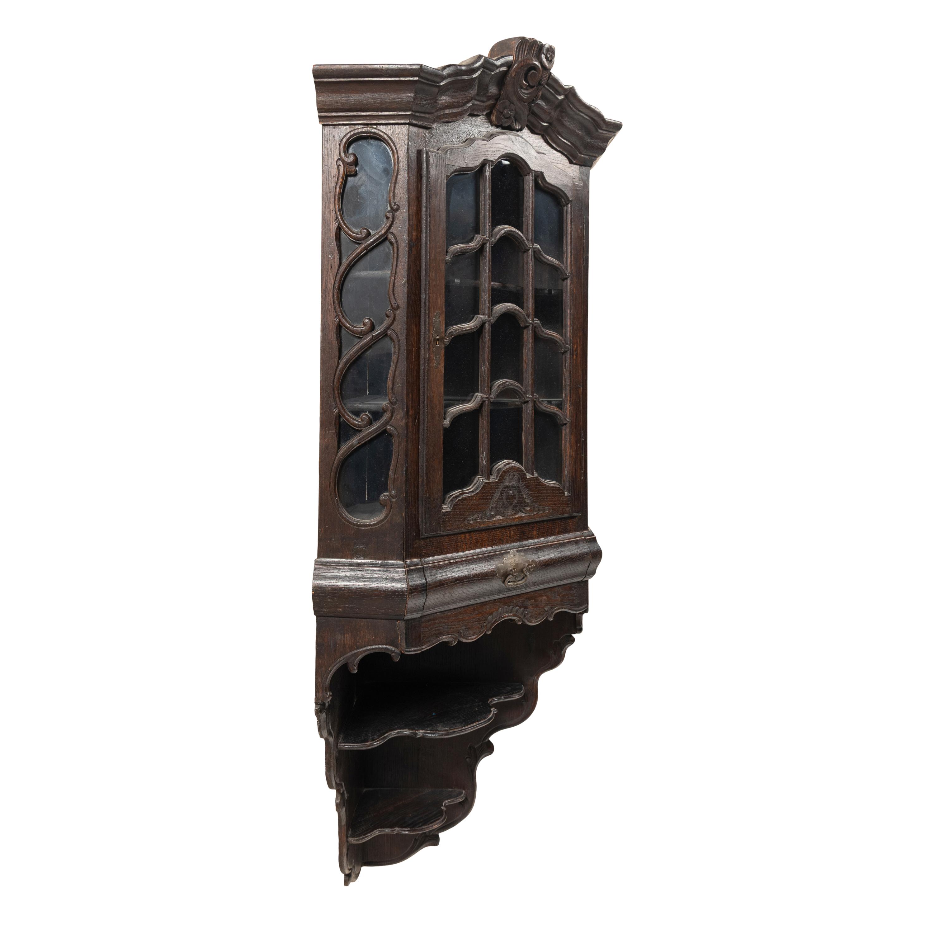 A Dutch Carved Oak Corner Cabinet