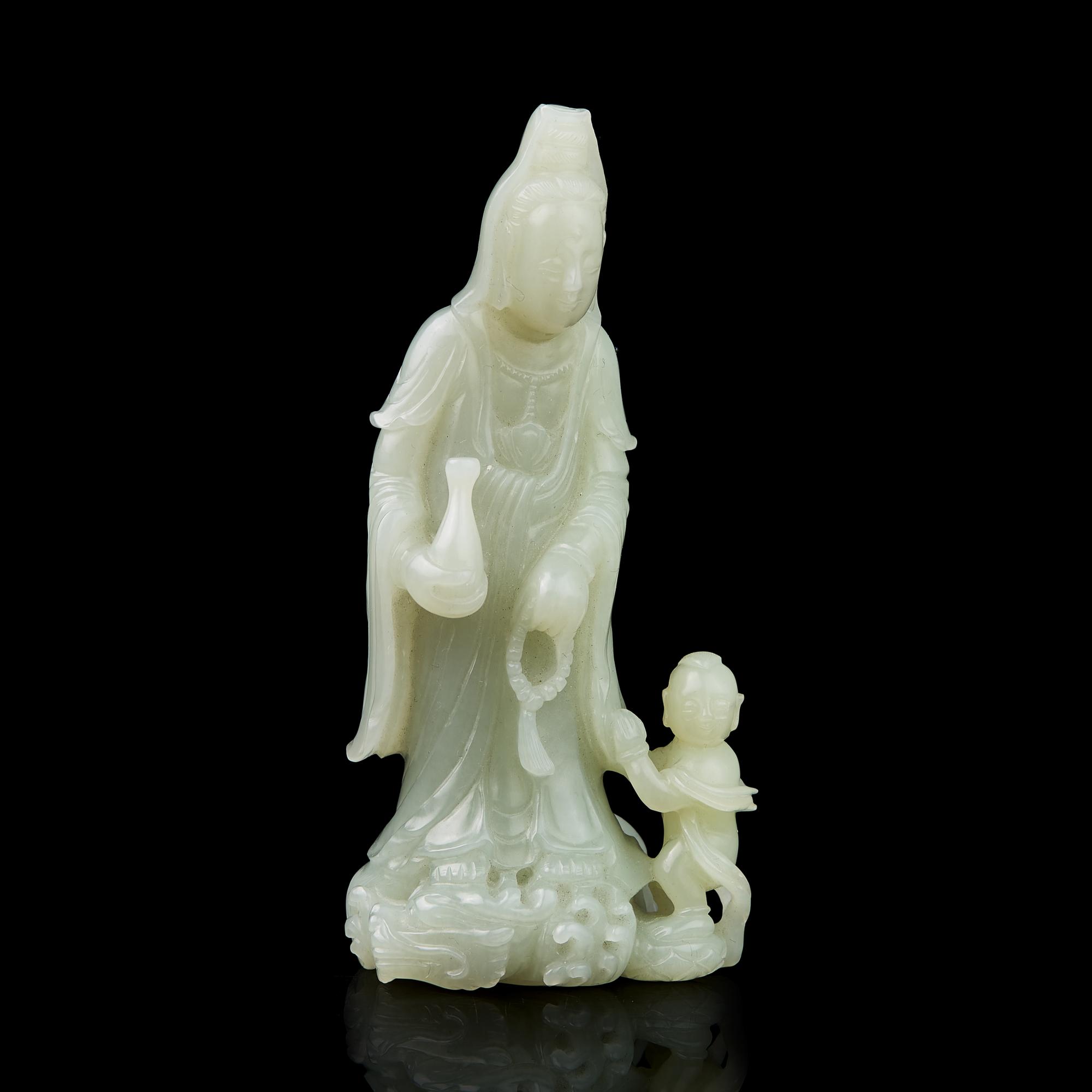 A Chinese Jade Figural Group of Guanyin and Boy 青白玉雕送子觀音