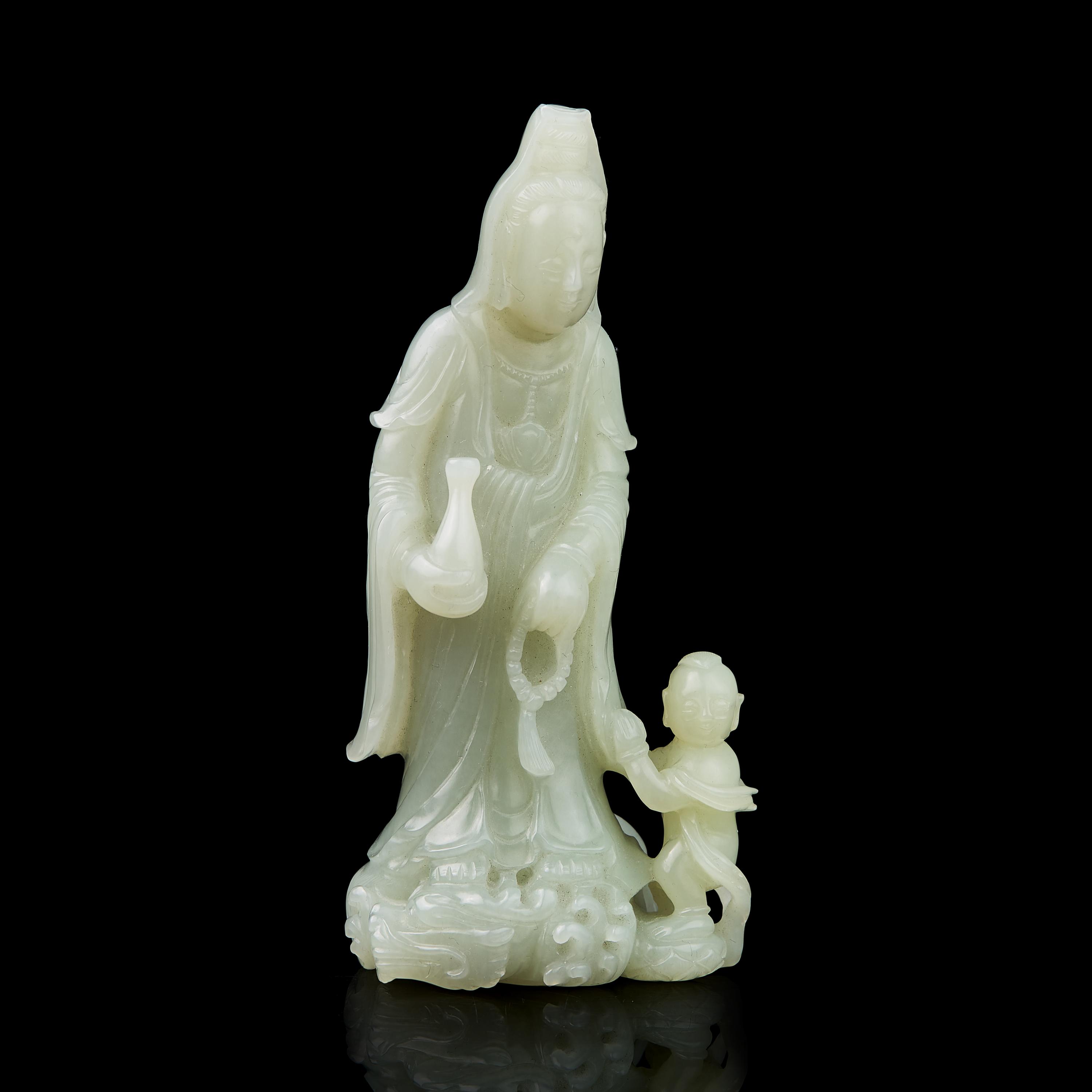 A Chinese Jade Figural Group of Guanyin and Boy 青白玉雕送子觀音