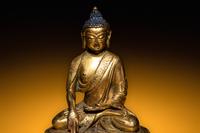 A Small Sino-Tibetan Gilt Bronze Figure of Seated Buddha Shakyamuni