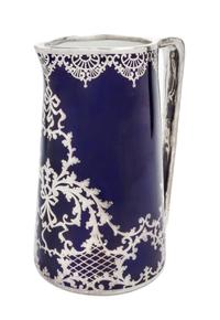 A Large Porcelain Silver Overlay Water Pitcher Height 10 1/2 inches.