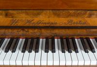A German Carved Walnut Upright Player Piano and Upholstered Bench