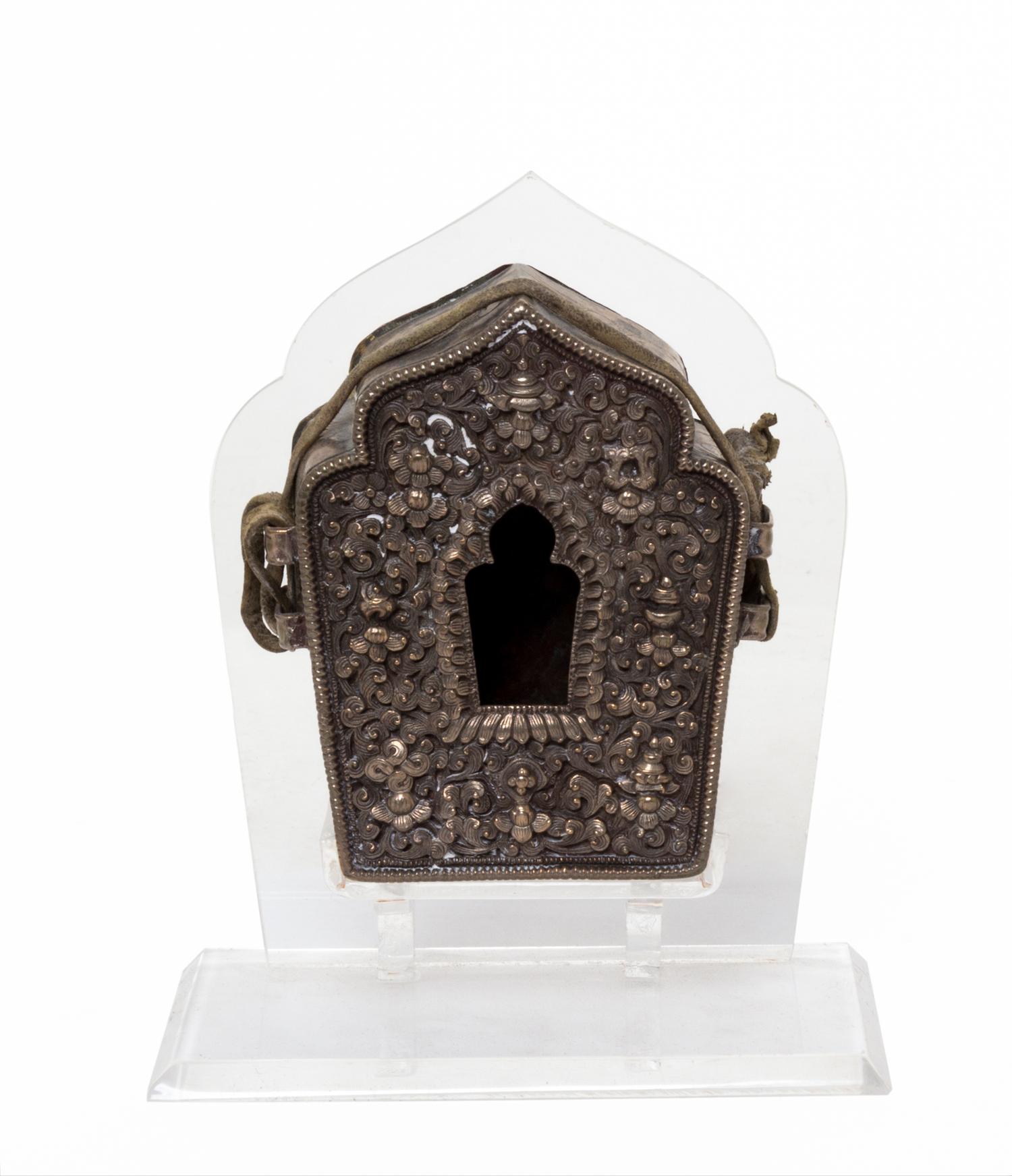 A Tibetan Repousse Silver and Copper Amulet Box, Gua Height 3 7/8 inches.