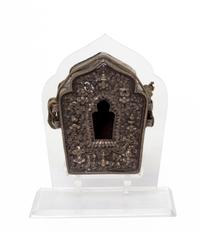 A Tibetan Repousse Silver and Copper Amulet Box, Gua Height 3 7/8 inches.