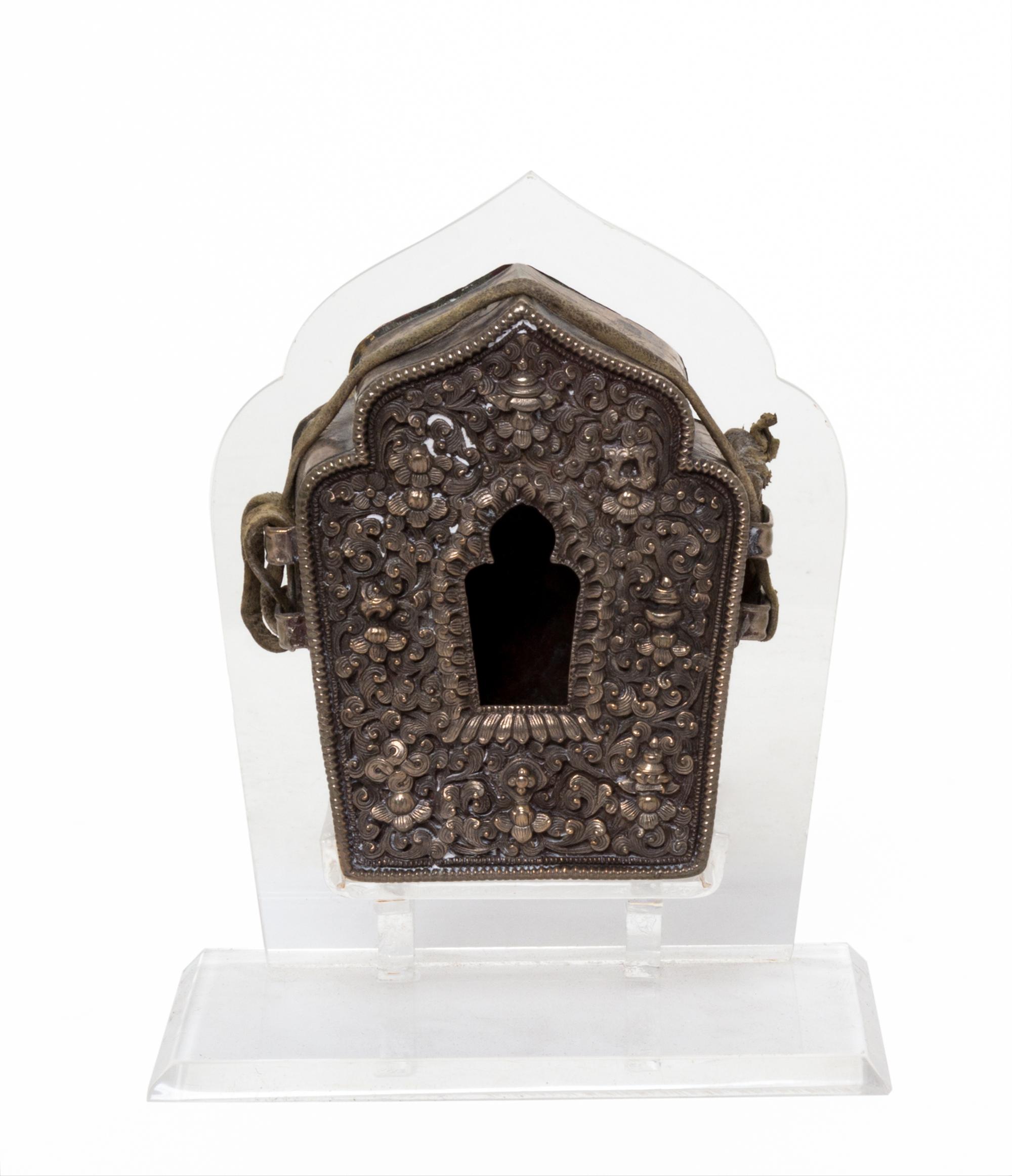 A Tibetan Repousse Silver and Copper Amulet Box, Gua Height 3 7/8 inches.