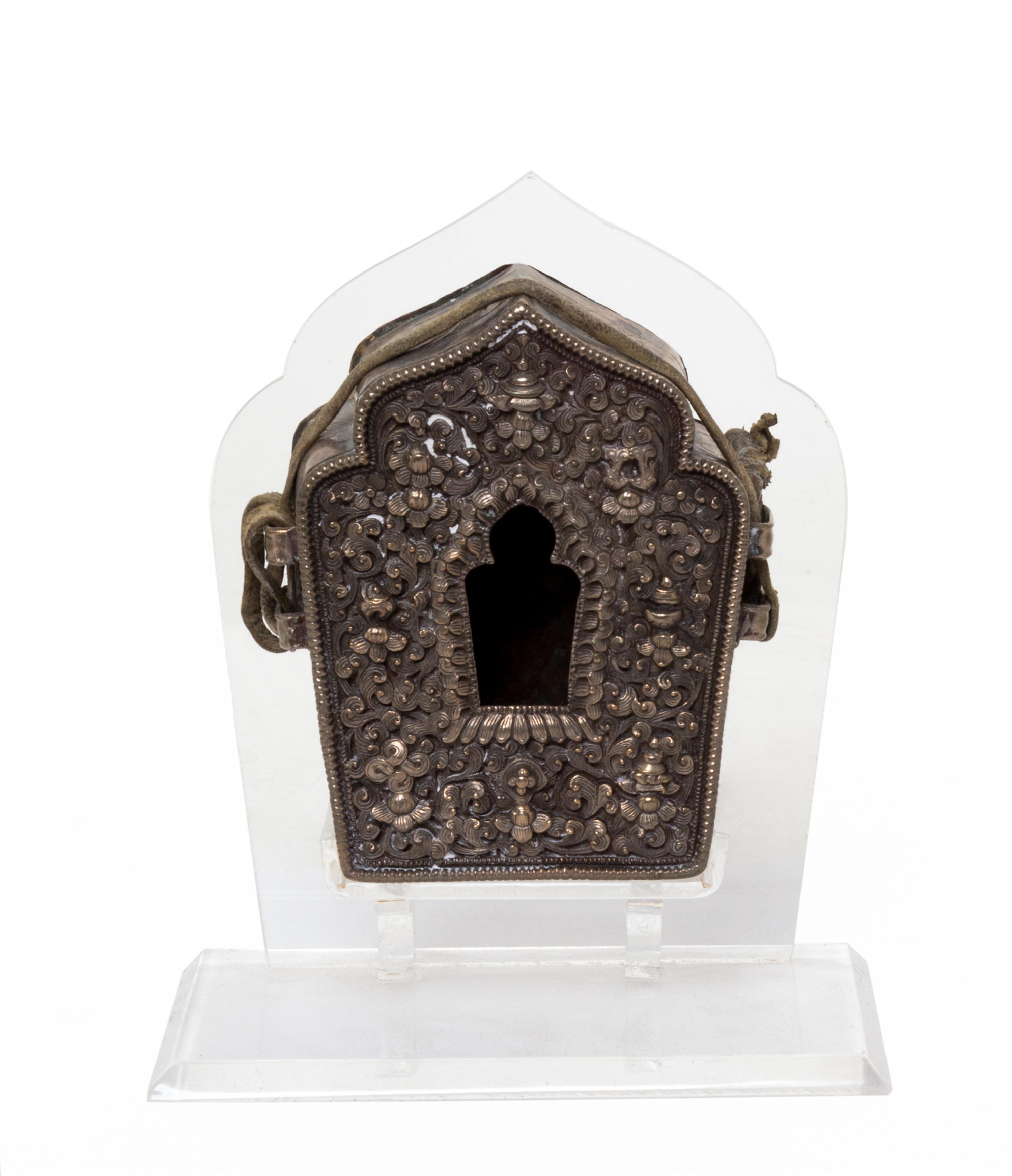 A Tibetan Repousse Silver and Copper Amulet Box, Gua Height 3 7/8 inches.