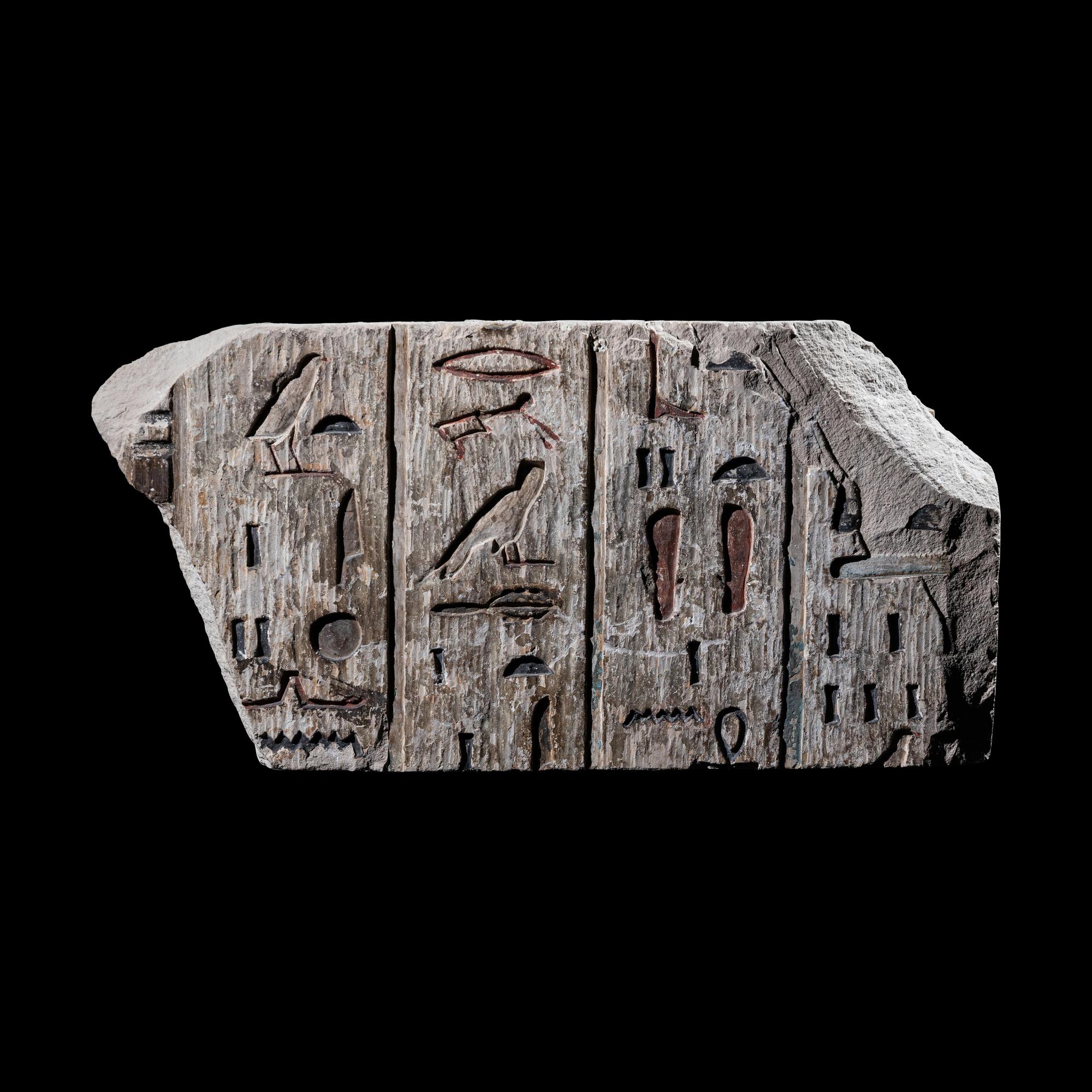 An Egyptian Polychrome Limestone Relief Fragment