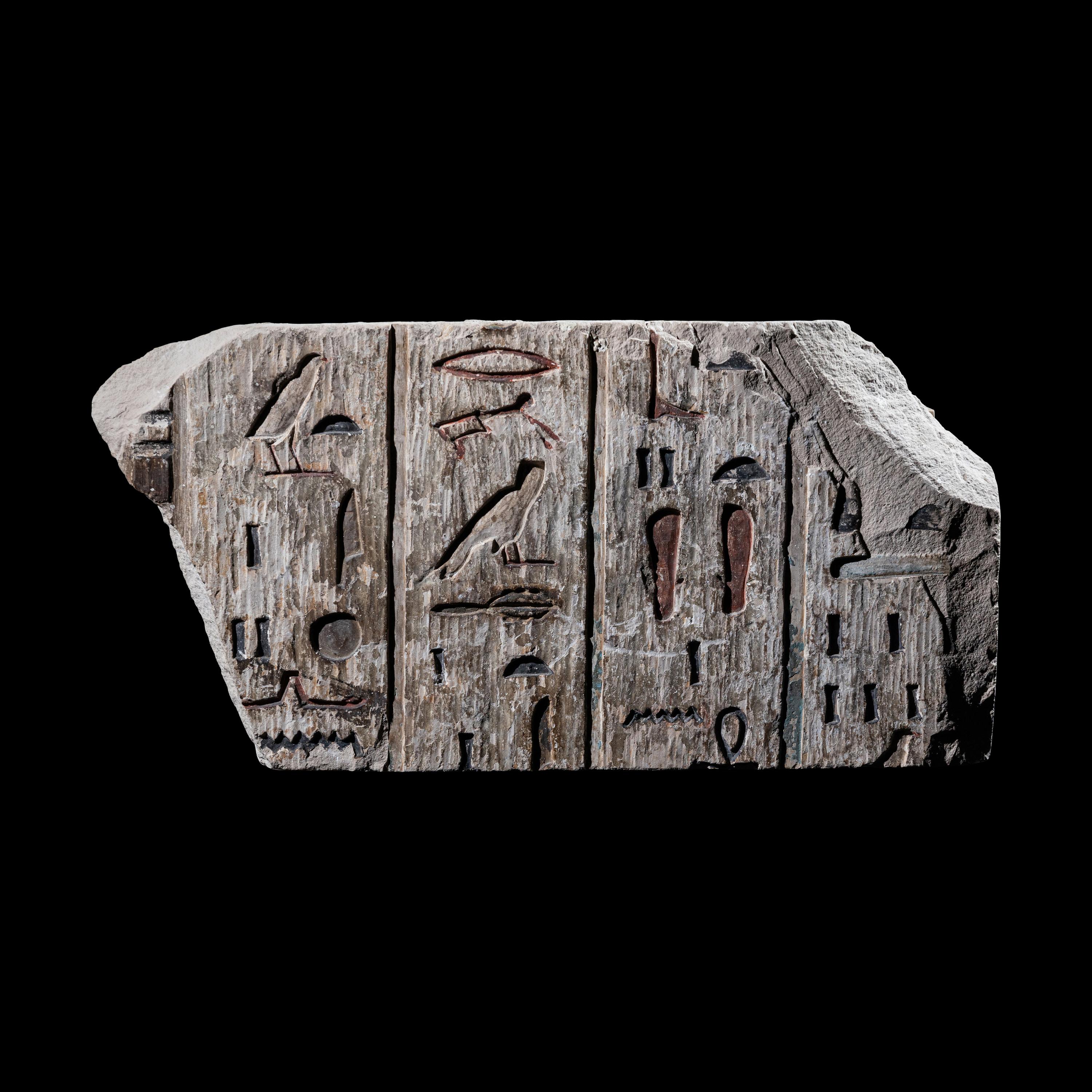 An Egyptian Polychrome Limestone Relief Fragment