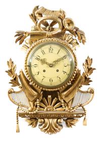 A Swedish Giltwood Cartel Clock Height 19 1/2 x width 13 3/4 x depth 4 1/2 inches. — 20TH CENTURY