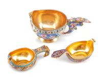 Three Russian Enameled Silver Kovshi, Various Makers, Late 19th/Early 20th Century, each having an exterior decorated with polychrome f