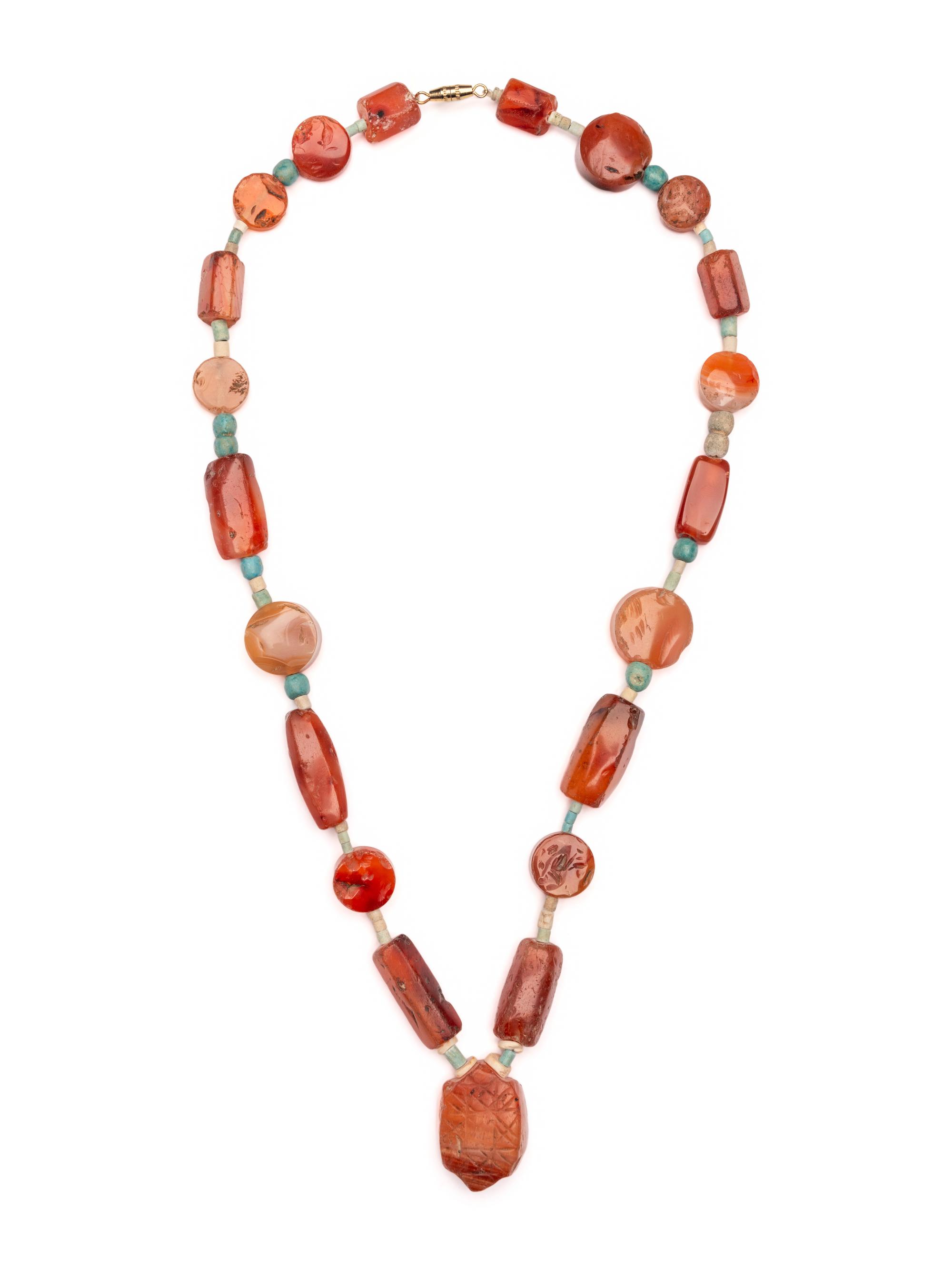 An Egyptian Carnelian and Faience Necklace