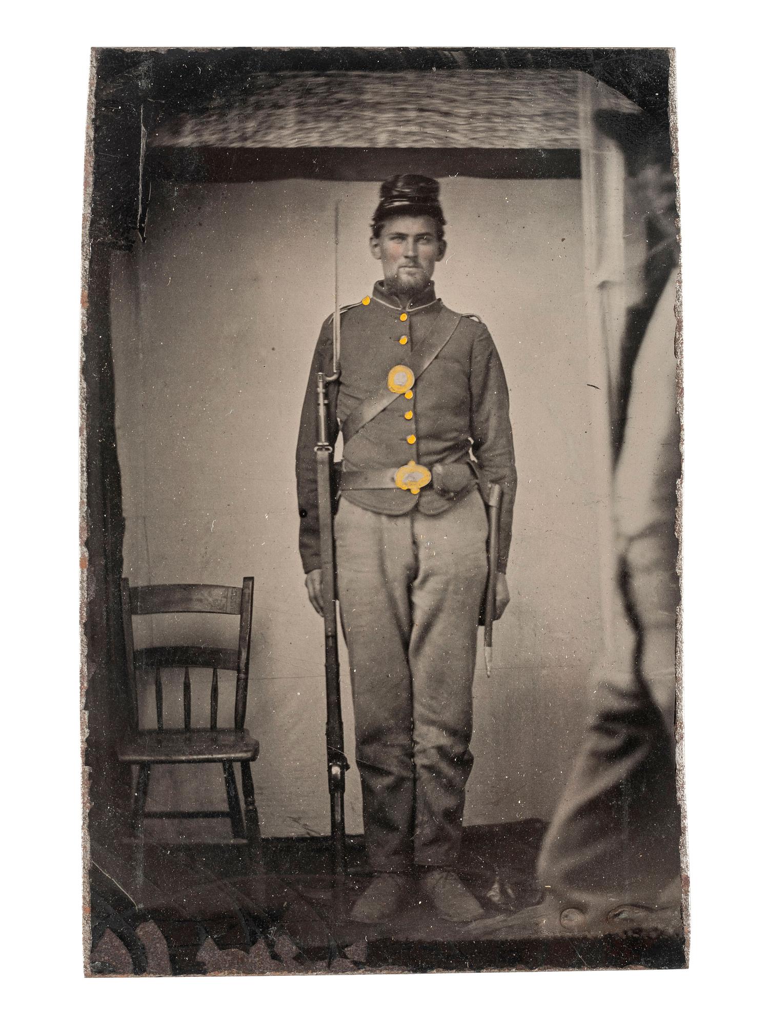 [CIVIL WAR]. CDV-sized tintype of a Union soldier armed with a musket with bayonet.