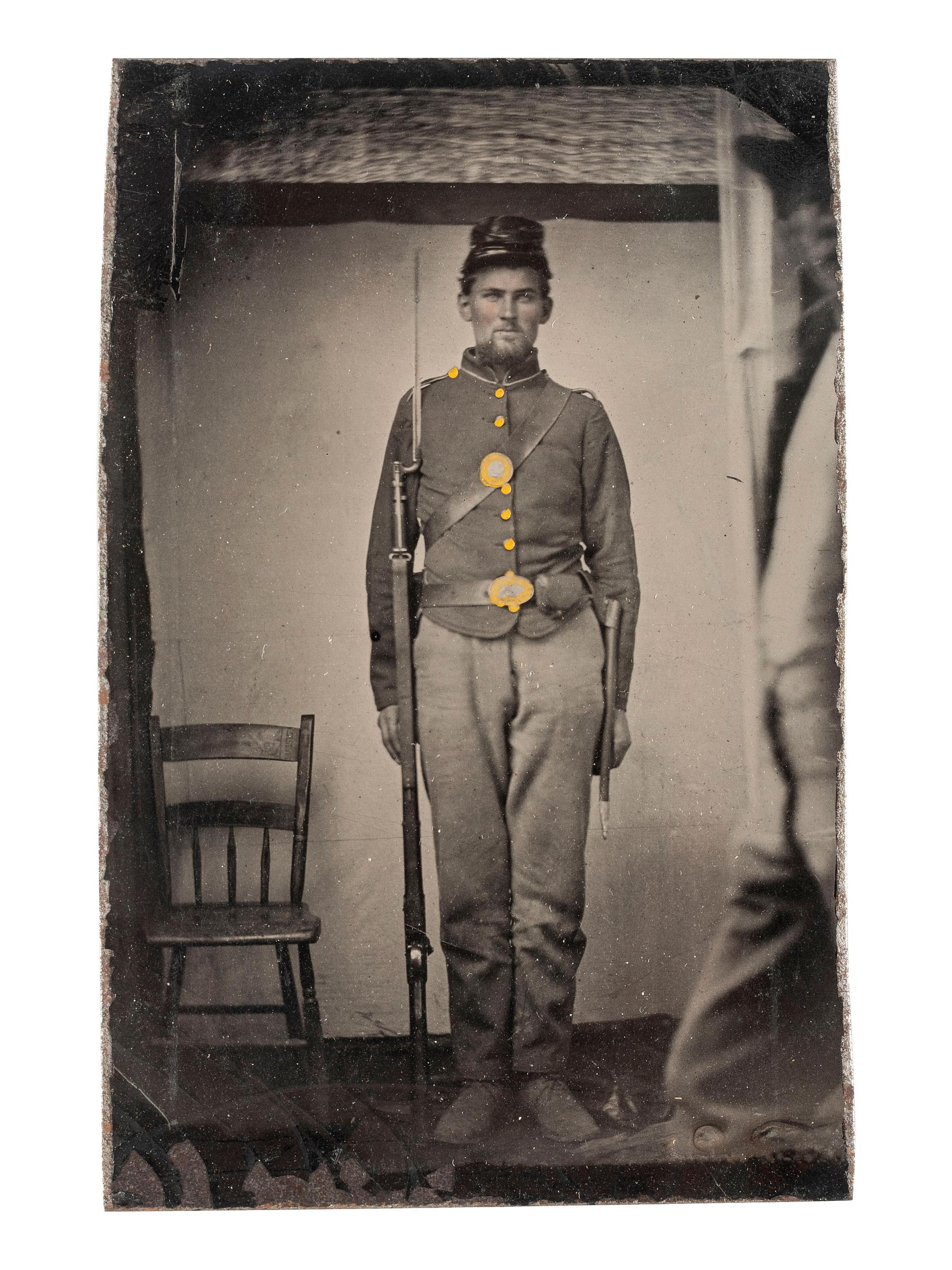 [CIVIL WAR]. CDV-sized tintype of a Union soldier armed with a musket with bayonet.