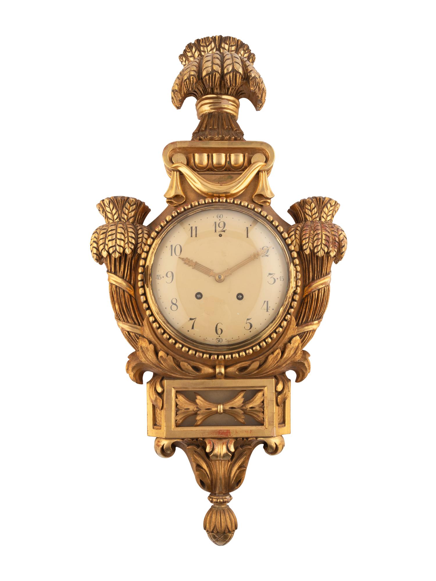 A Continental Giltwood Cartel Clock