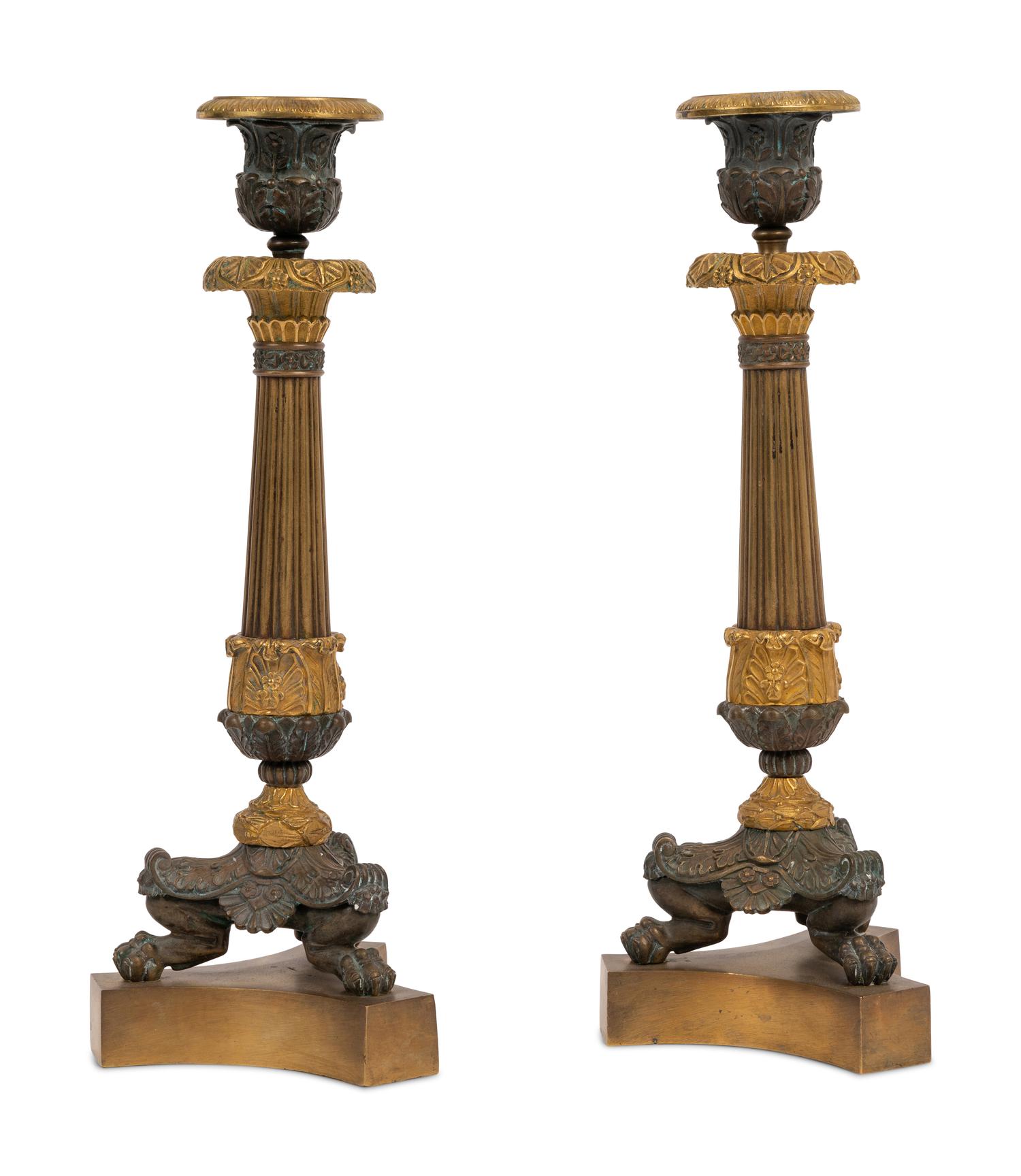 A Pair of Neoclassical Style Gilt and Patinated Bronze Candlesticks