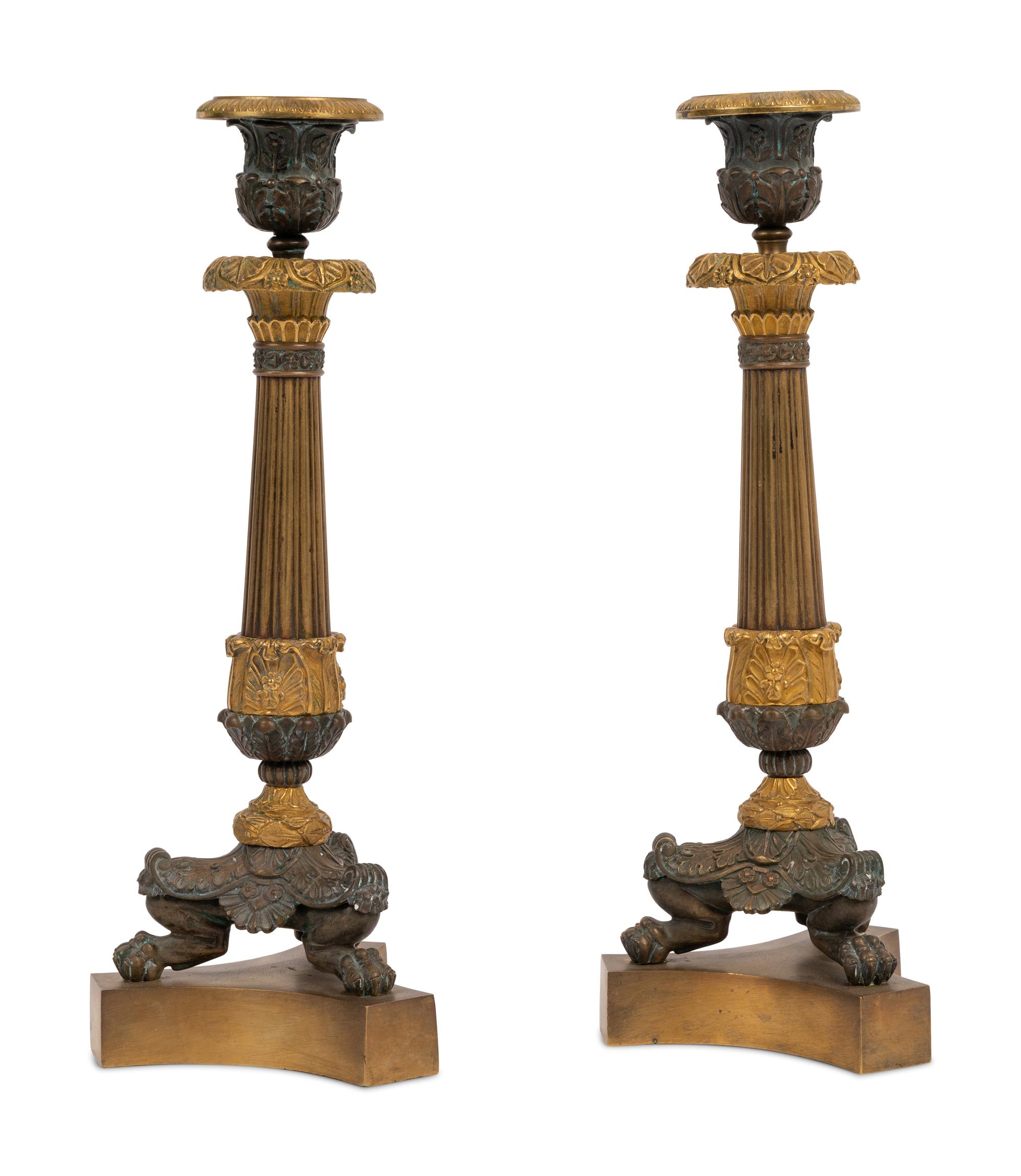 A Pair of Neoclassical Style Gilt and Patinated Bronze Candlesticks