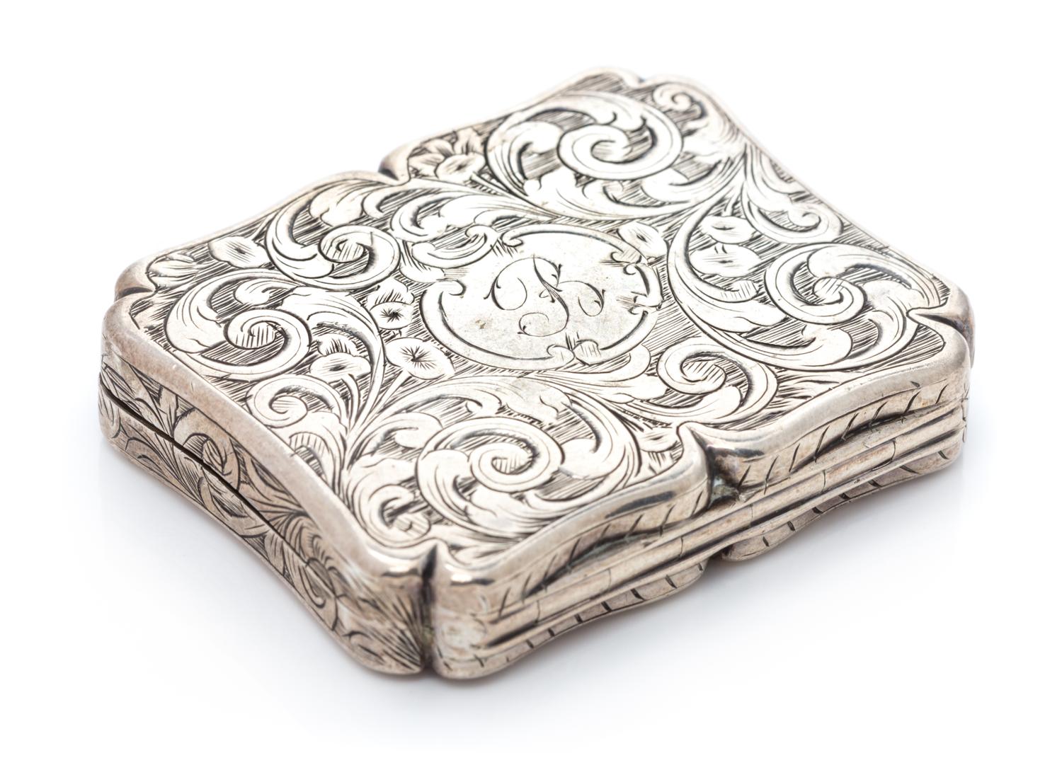 A Victorian Silver Vinaigrette, Edward Smith, Birmingham, 1844, the lid decorated with a pastoral scene, the case with floral and folia