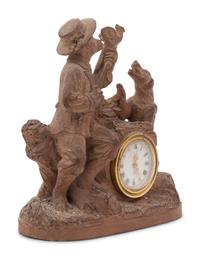 A Continental Terra Cotta Figural Clock
