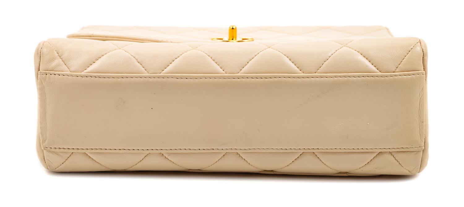 A Chanel Cream Lambskin Quilted Square Flap Bag, 8" H x 9.5" W x 3" D; Handle drop: 3".