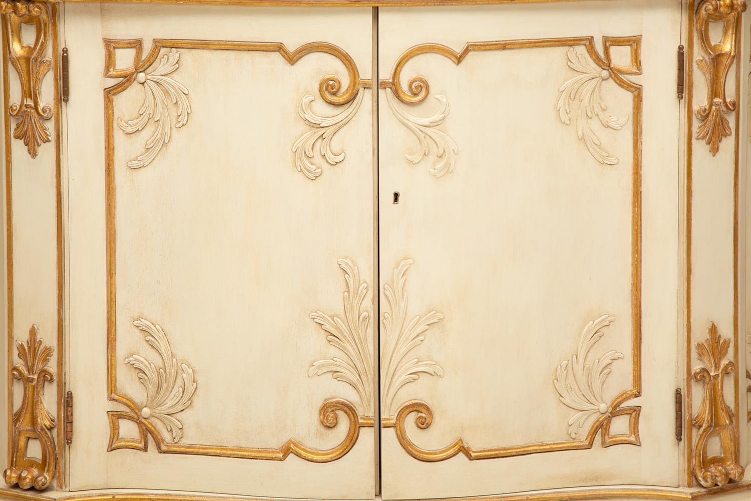 A Pair of Painted and Parcel Gilt Serpentine-Front Cabinets