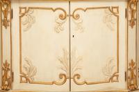 A Pair of Painted and Parcel Gilt Serpentine-Front Cabinets