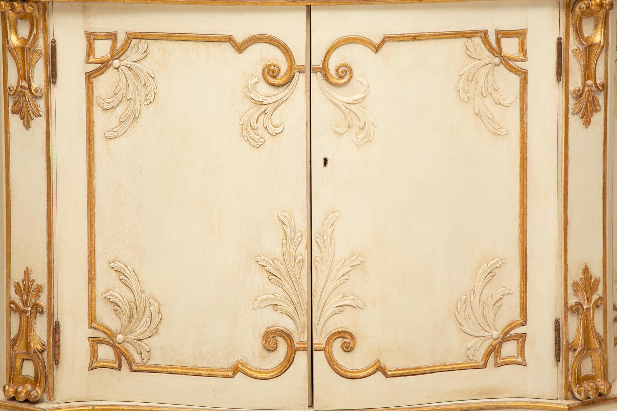 A Pair of Painted and Parcel Gilt Serpentine-Front Cabinets