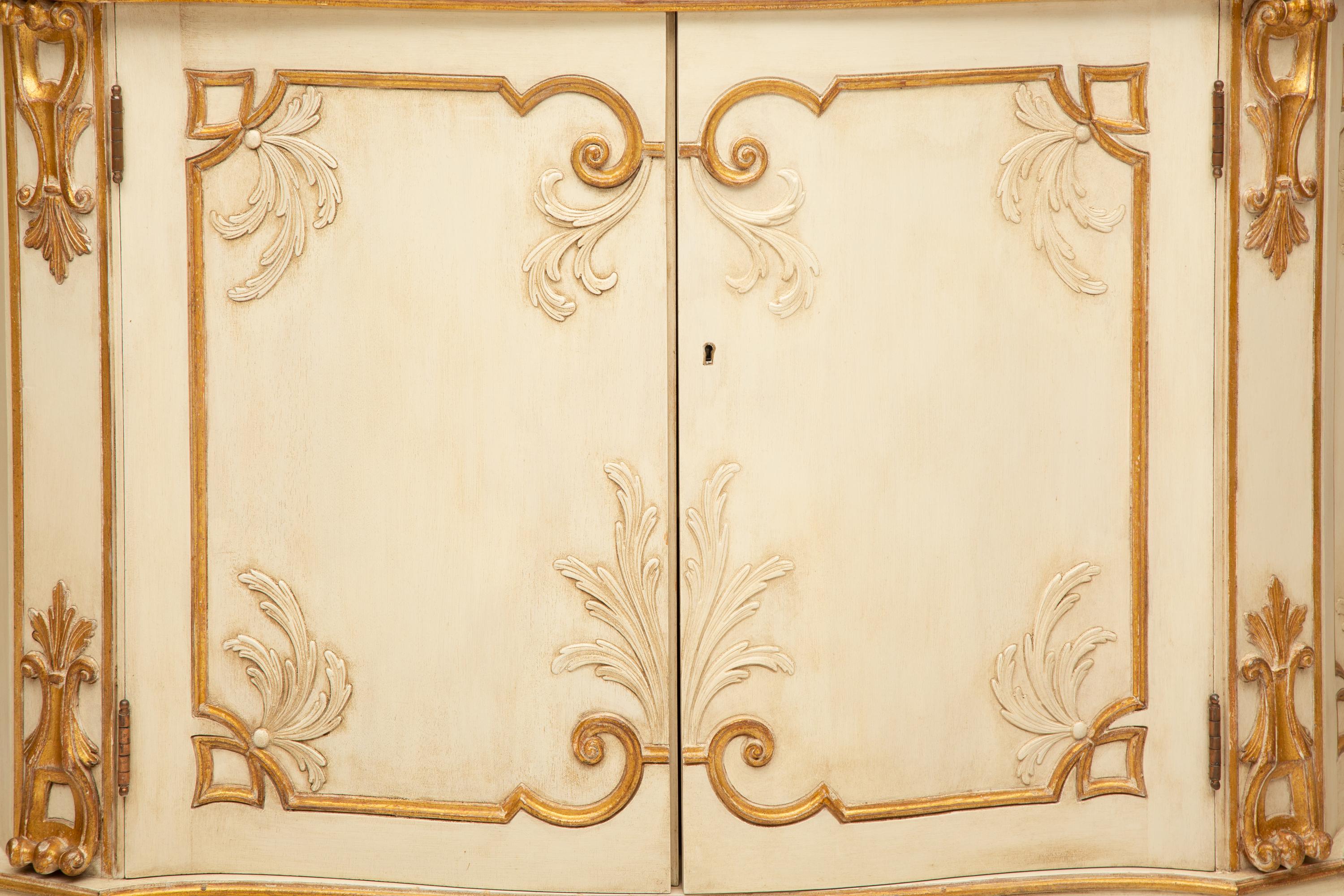 A Pair of Painted and Parcel Gilt Serpentine-Front Cabinets