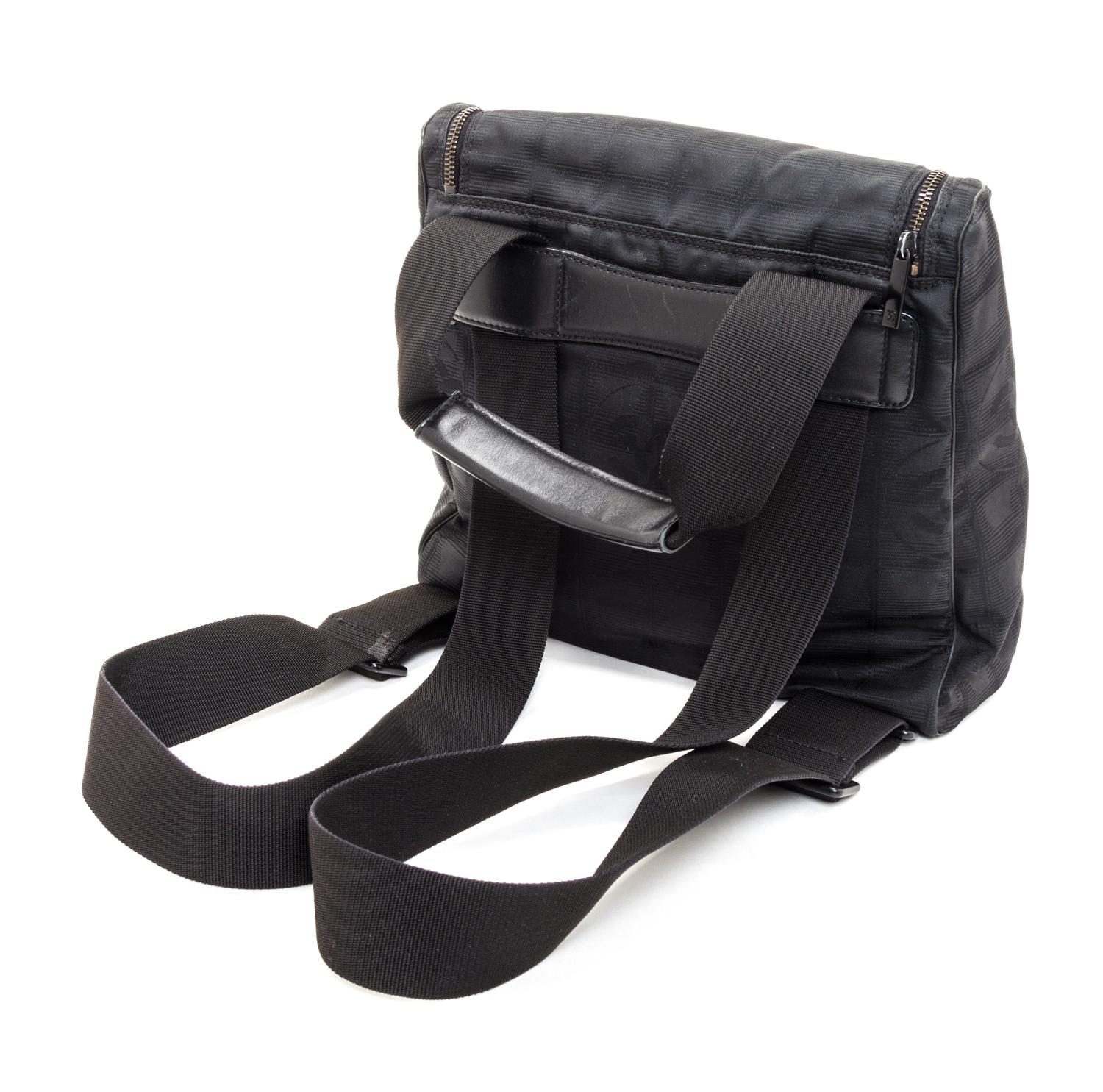 A Chanel Black Neoprene Cross Body Bag, 11" x 9.5" X 4".