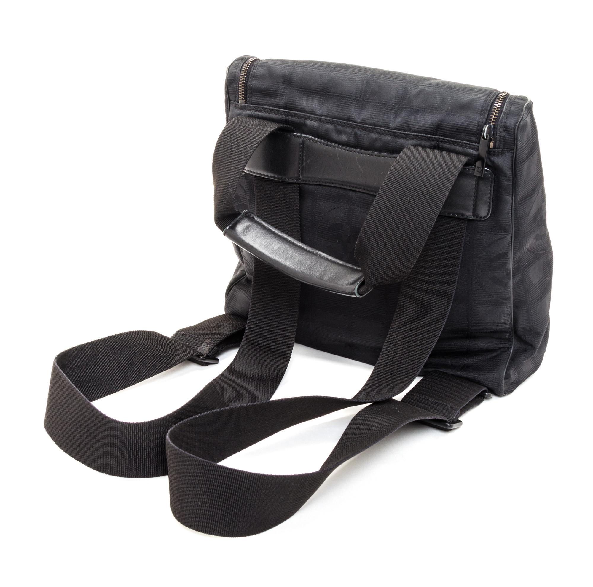 A Chanel Black Neoprene Cross Body Bag, 11" x 9.5" X 4".