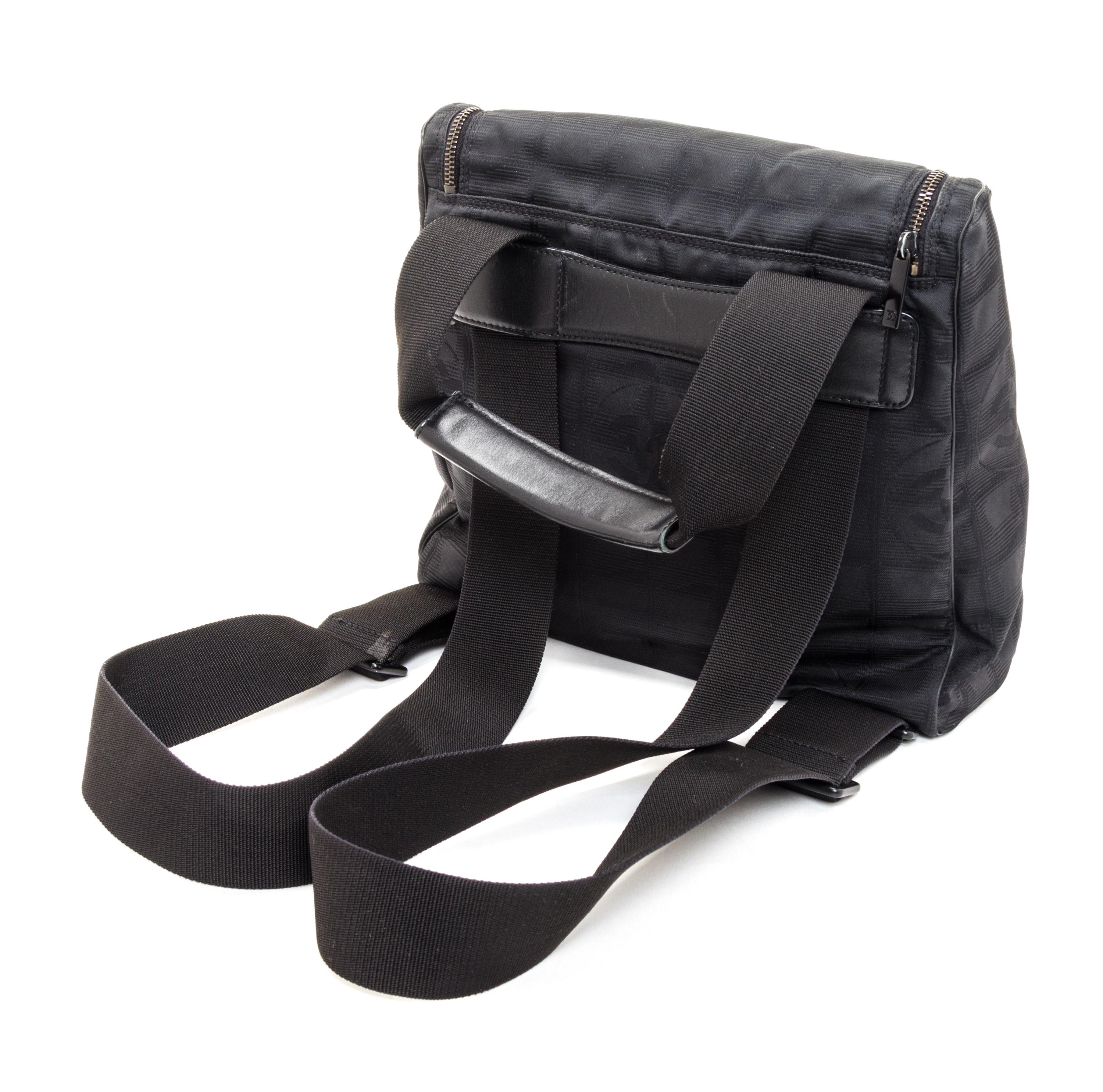A Chanel Black Neoprene Cross Body Bag, 11" x 9.5" X 4".
