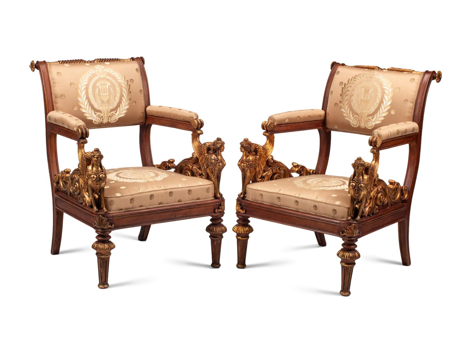 A Pair of Empire Style Parcel Gilt Walnut Armchairs