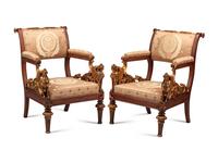A Pair of Empire Style Parcel Gilt Walnut Armchairs