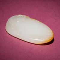 A Chinese Russet and White Jade 'Chilong' Pendant, 18th/19th Century — 清中期 白玉留皮螭龍紋佩