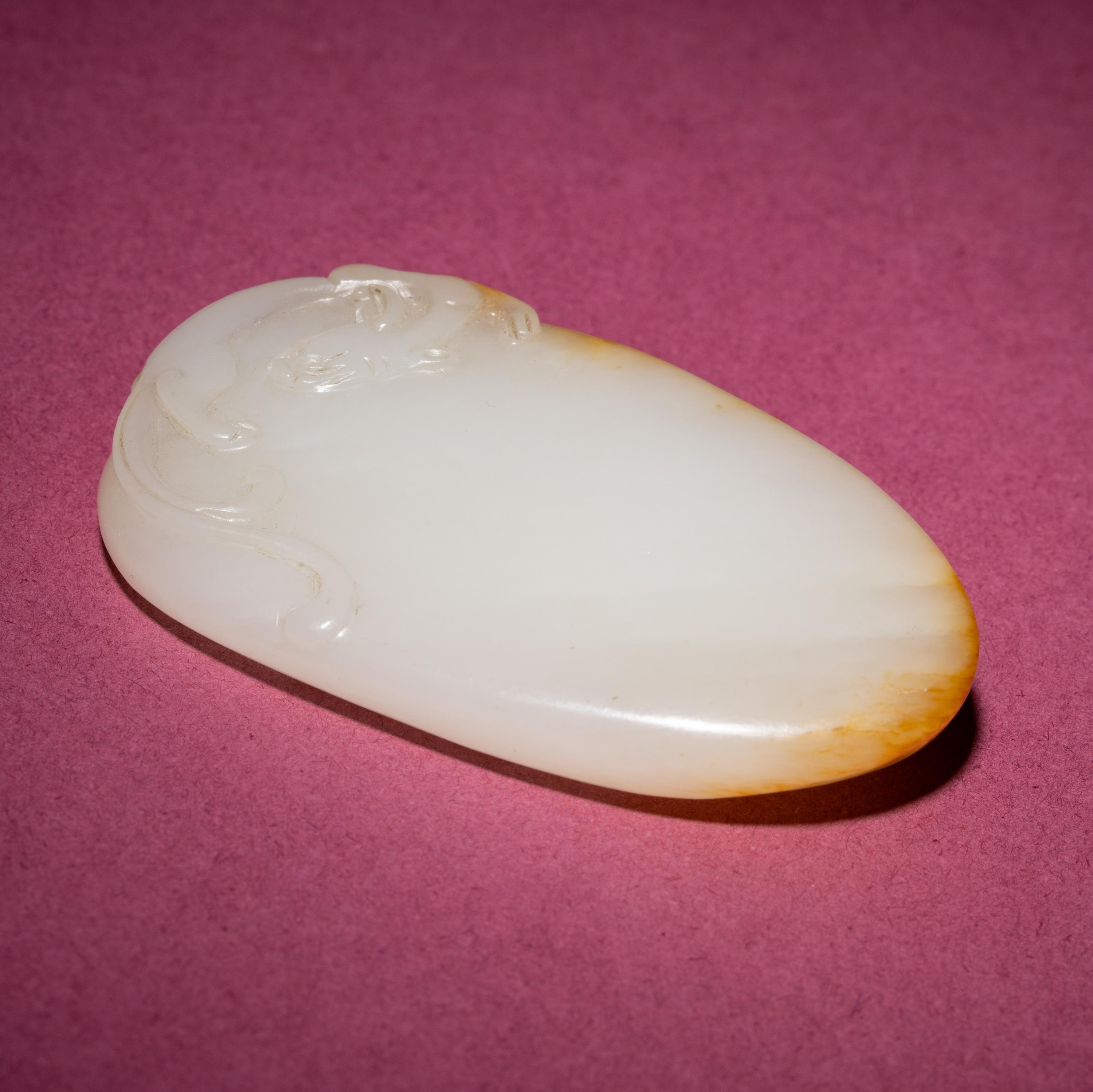 A Chinese Russet and White Jade 'Chilong' Pendant, 18th/19th Century — 清中期 白玉留皮螭龍紋佩