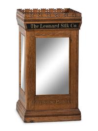 A Leonard Silk Co. Oak Floor Spool Cabinet
