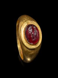 A Roman Gold and Garnet Finger Ring with the Goddesses Athena and Nike