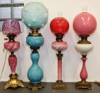 Four Victorian Fluid Lamps Height of tallest 38 inches. — 19TH/20TH CENTURY