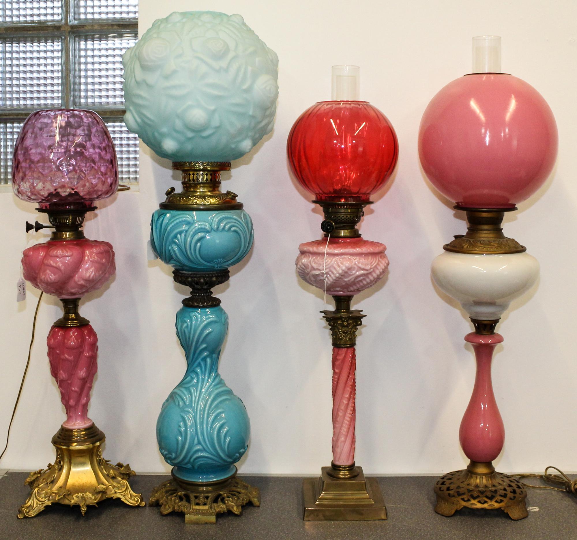 Four Victorian Fluid Lamps Height of tallest 38 inches. — 19TH/20TH CENTURY