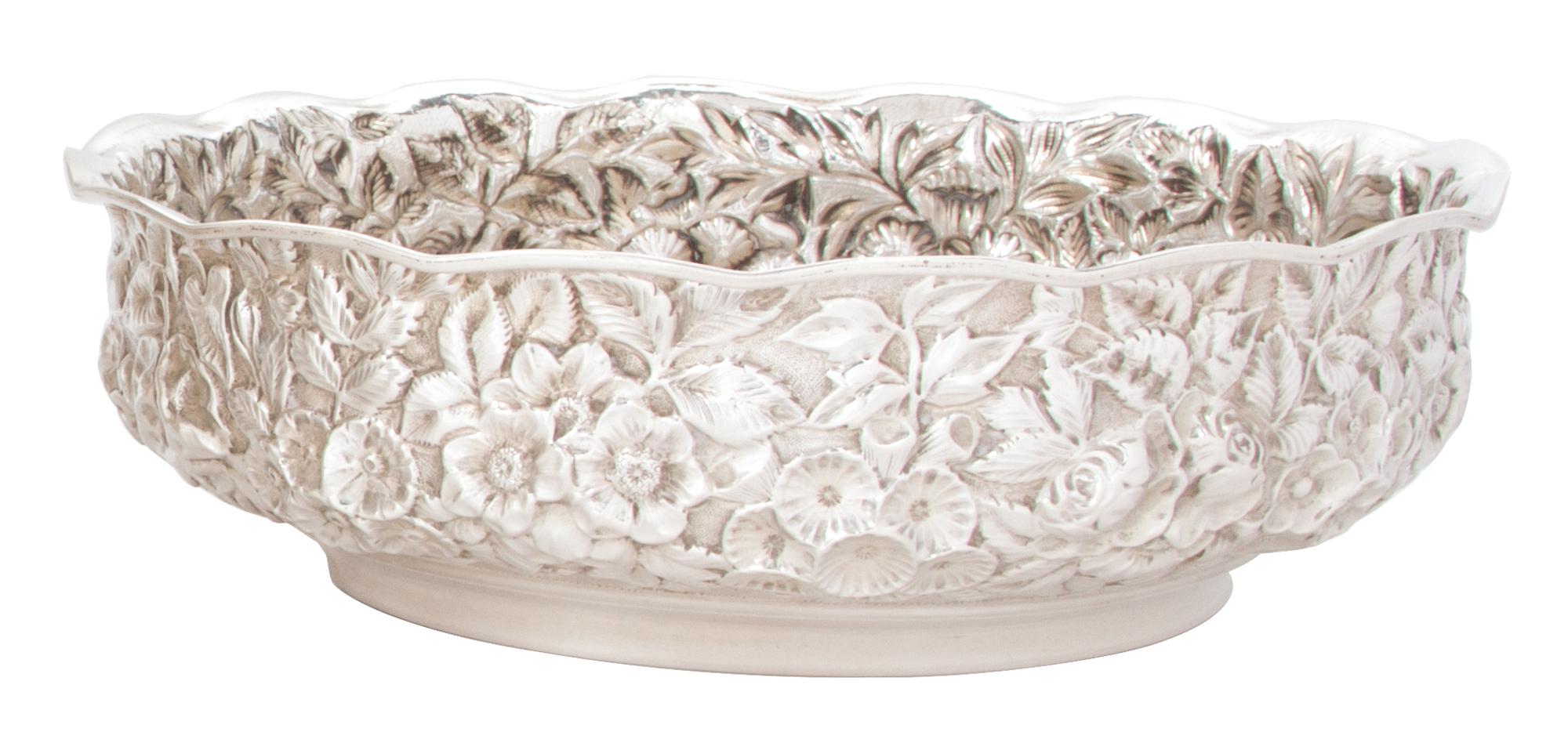 An American Silver Repousse Low Bowl, Hennegan, Bates & Co., Baltimore, Maryland, the circular bowl with scalloped rim and floral repou