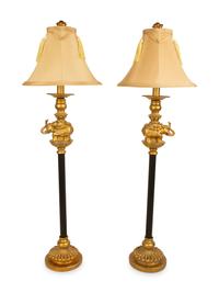 A Pair of Empire Style Ebonized and Gilt Metal Elephant Candlesticks now Mounted as Lamps — 20TH CENTURY