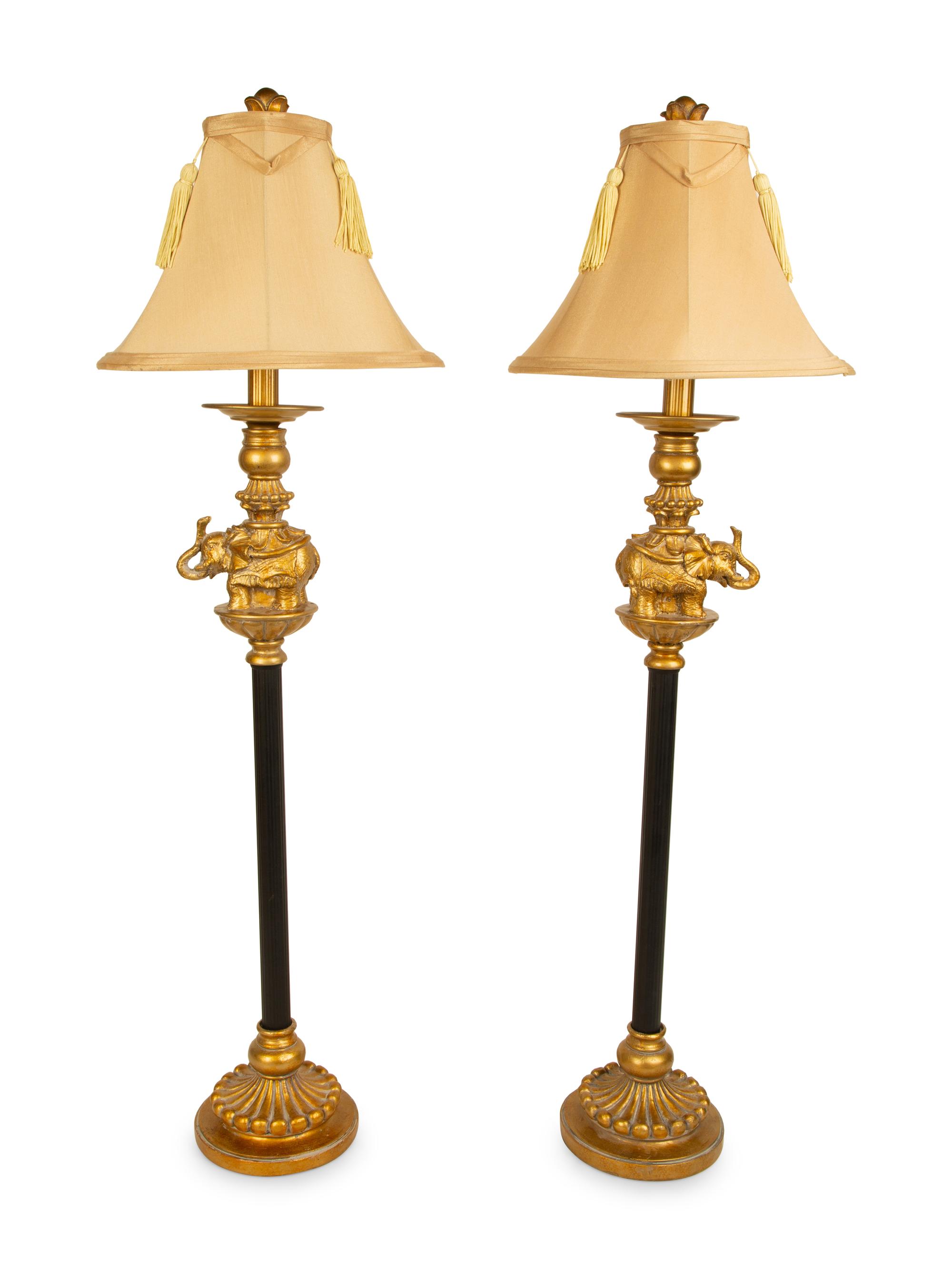 A Pair of Empire Style Ebonized and Gilt Metal Elephant Candlesticks now Mounted as Lamps — 20TH CENTURY