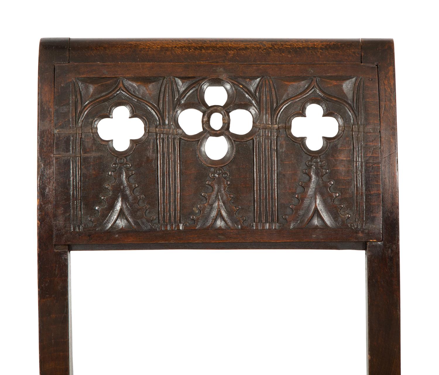 A Pair of Continental Carved Oak 'Gothic' Folding Chairs