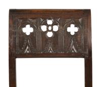 A Pair of Continental Carved Oak 'Gothic' Folding Chairs
