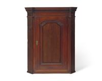 A George III Carved Oak Hanging Corner Cupboard