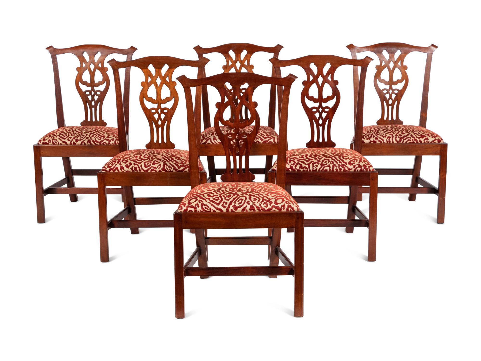 A Set of Twelve Joseph Gaar Dining Chairs
