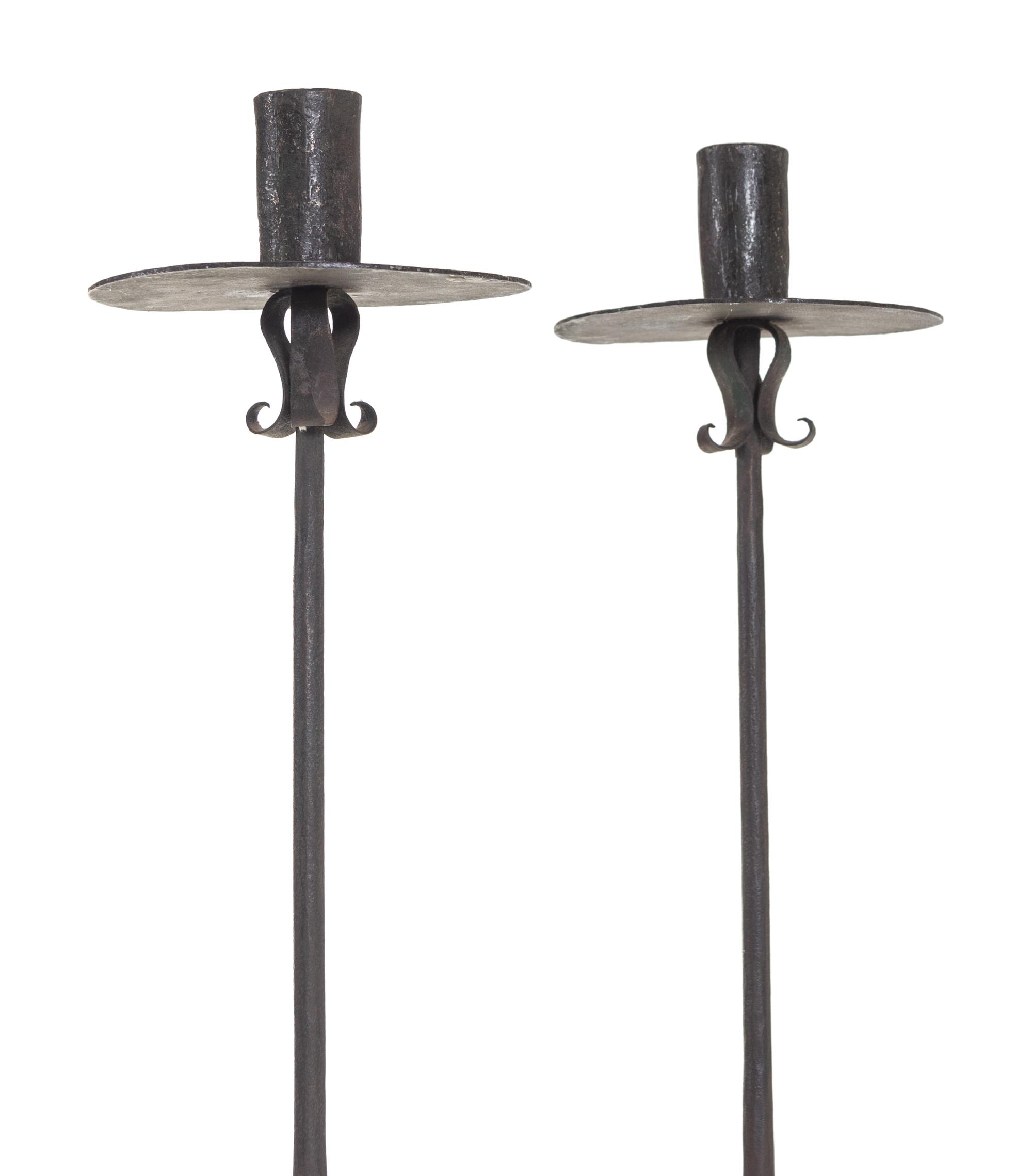 A Pair of Spanish Wrought Iron Floor Candlesticks